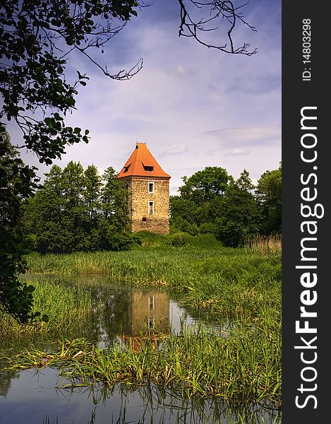 Old ancient knight tower at the lake in Poland. Old ancient knight tower at the lake in Poland