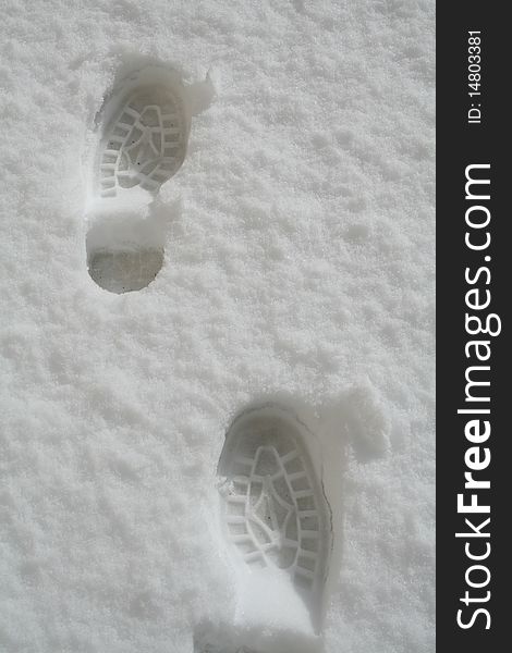 Two shoe marks in the snow. Two shoe marks in the snow