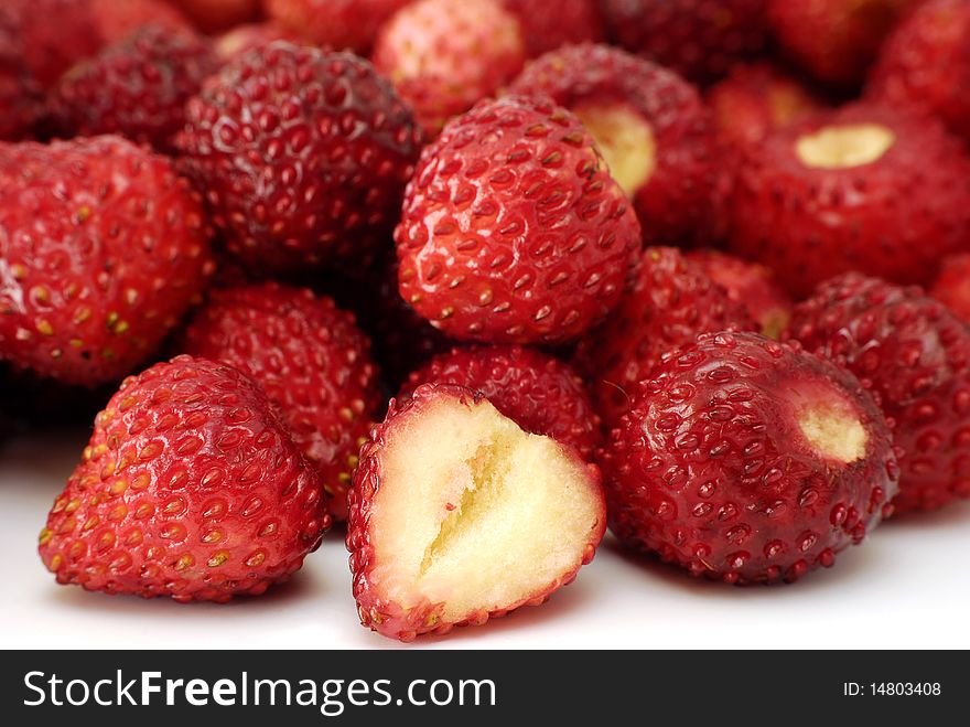 Wild strawberries made out on the white background. Wild strawberries made out on the white background