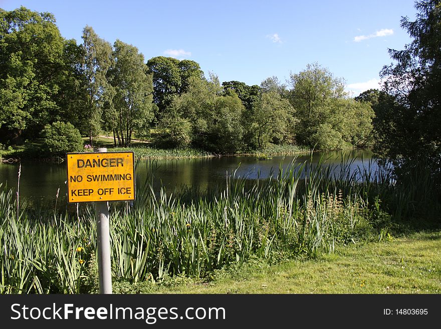 Danger sign next to a lake