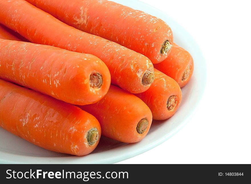 Fresh healthy carrots on a plate