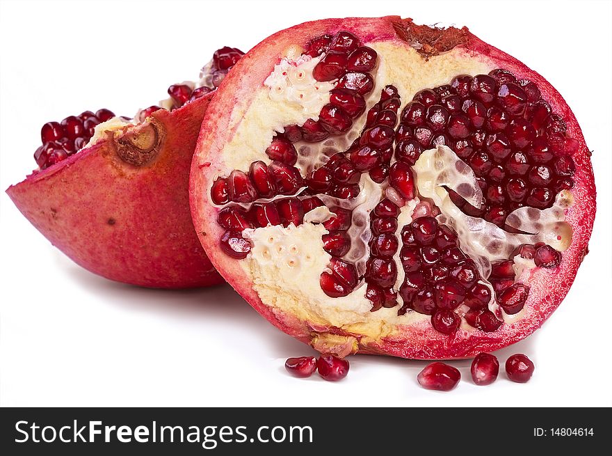 Pomegranate slices and stone on white background. Pomegranate slices and stone on white background