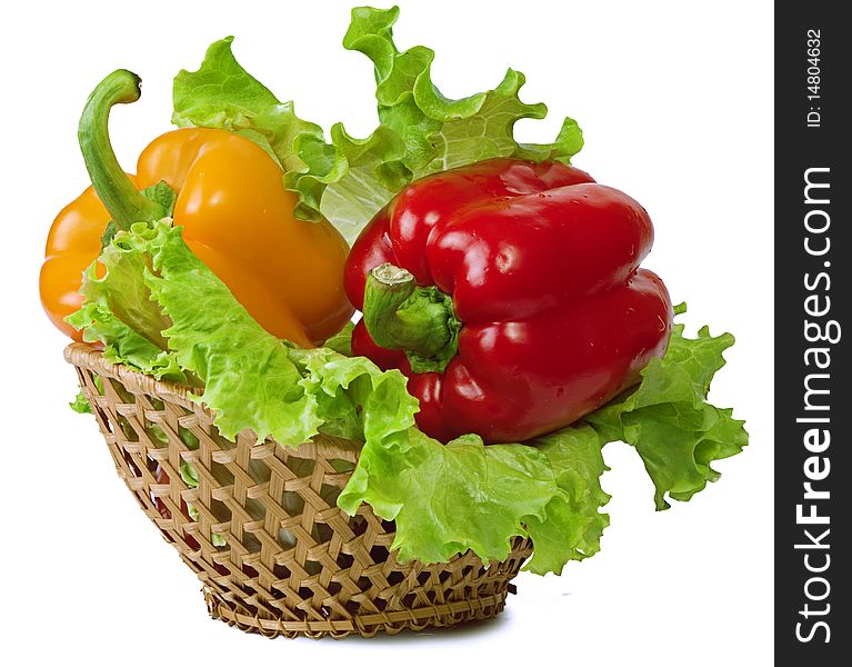 Sweet pepper in a basket on white background
