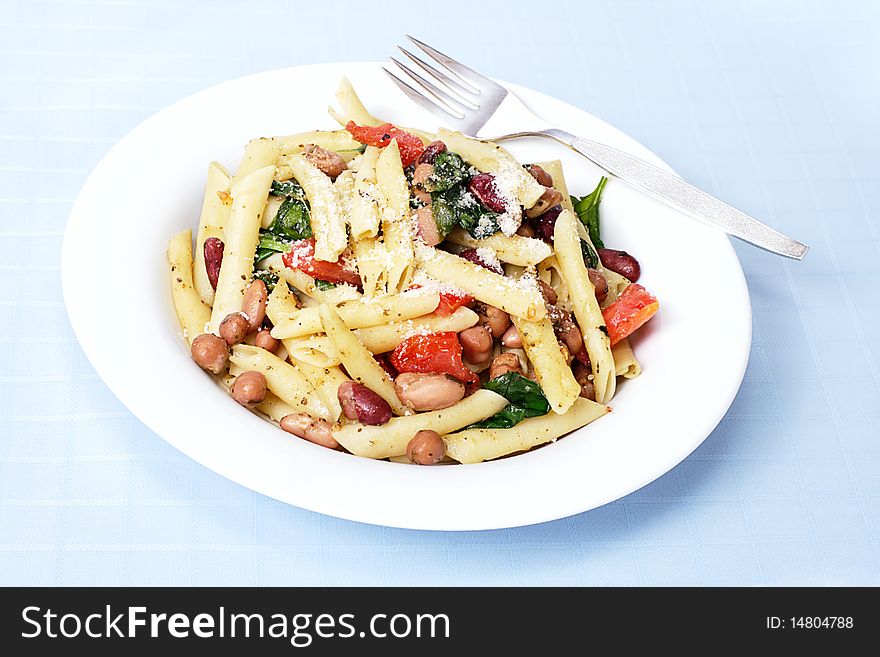 Health vegetarian meal made with fresh tomato and baby spinach. Health vegetarian meal made with fresh tomato and baby spinach