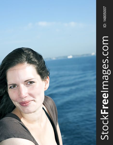 Portrait of a smiling woman on the upper deck of a cruise ship. Portrait of a smiling woman on the upper deck of a cruise ship