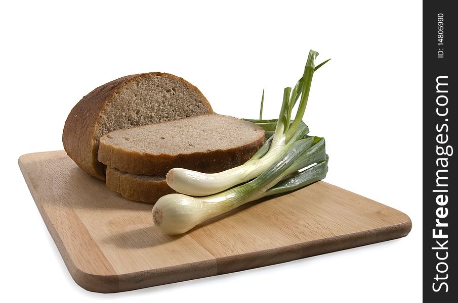 Slices of bread on a breadboard, isolated. Slices of bread on a breadboard, isolated