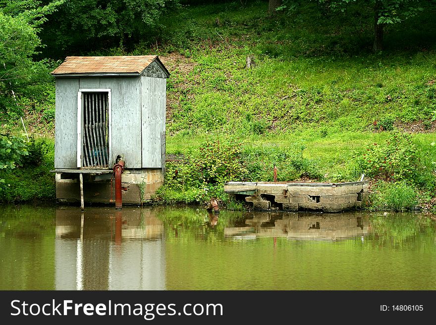 A Pump house on a small pond