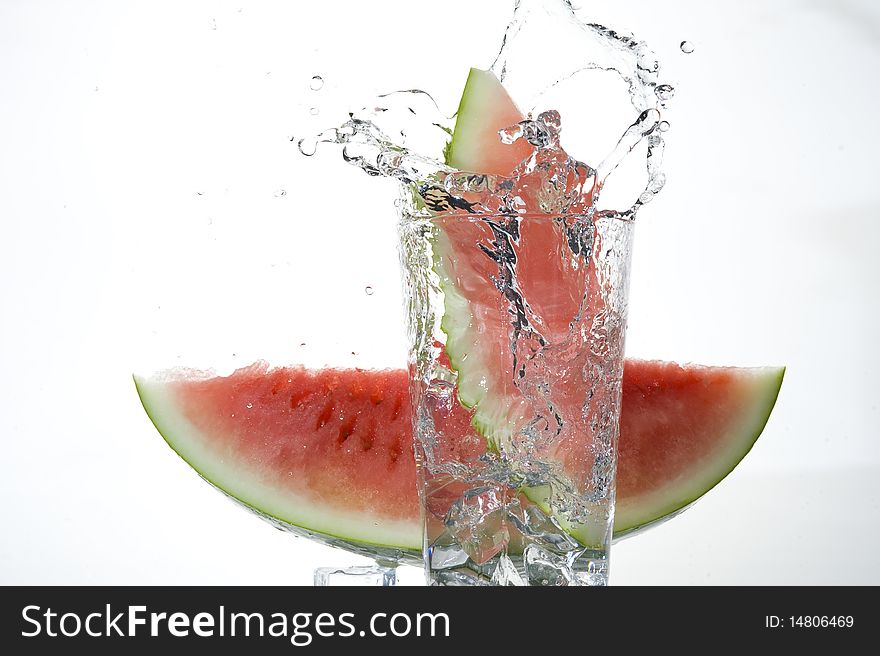 Water-melon falling on the clear water