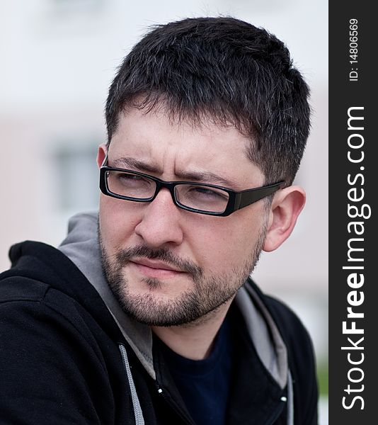 Portrait of a young male caucasian student with beard and glasses. Portrait of a young male caucasian student with beard and glasses