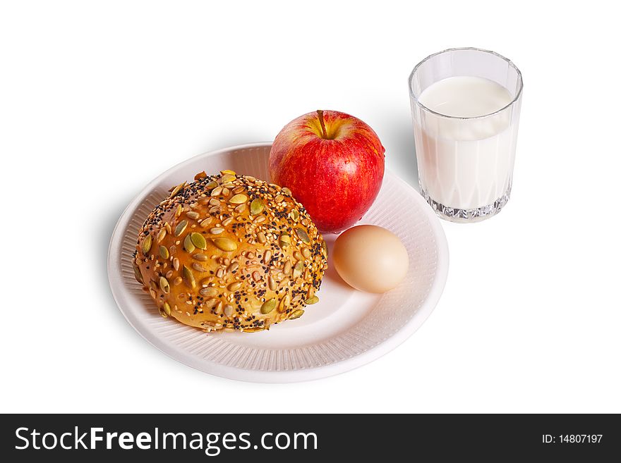 The healthy breakfast include bread, egg, apple and a cup of milk.