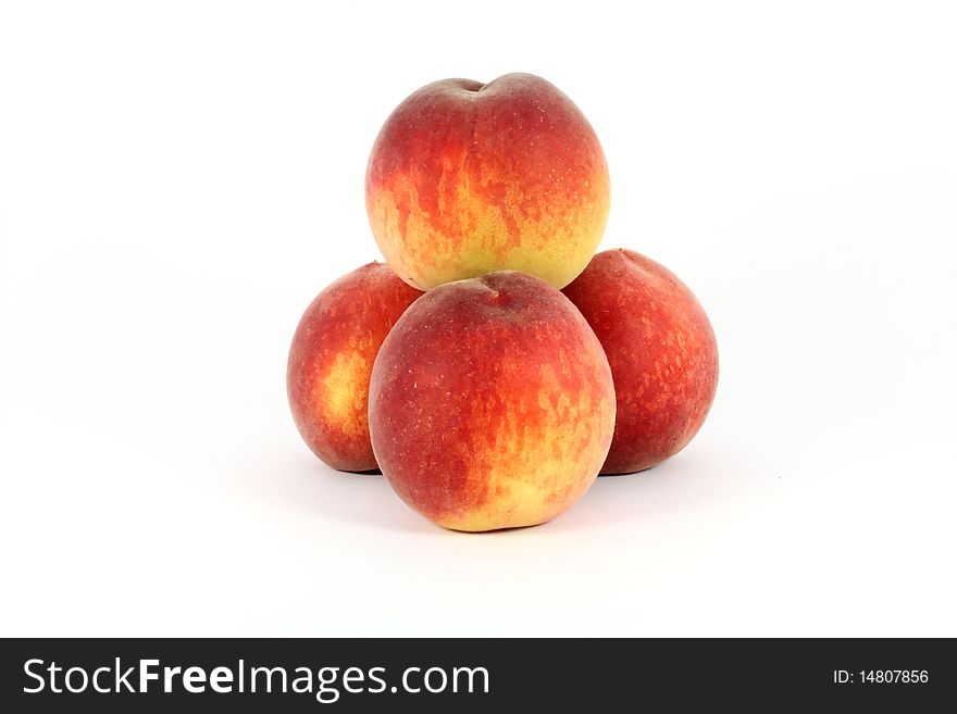 Fresh colorful ripe peaches isolated on white