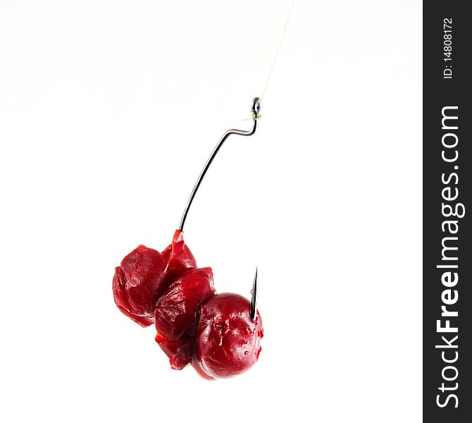 A fishing hook with frozen cherry