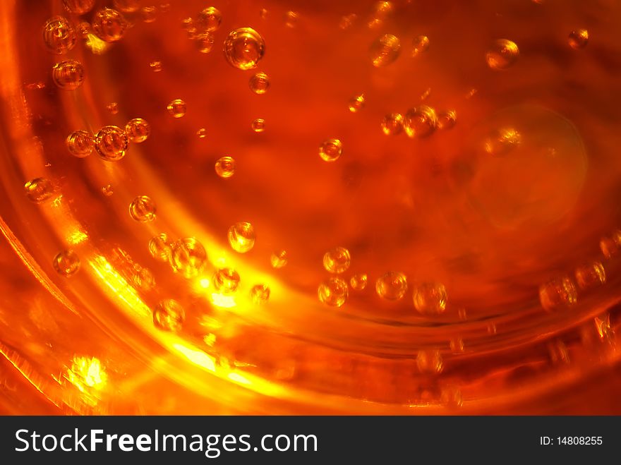 Background from a surface of beer with a sun beam. Background from a surface of beer with a sun beam