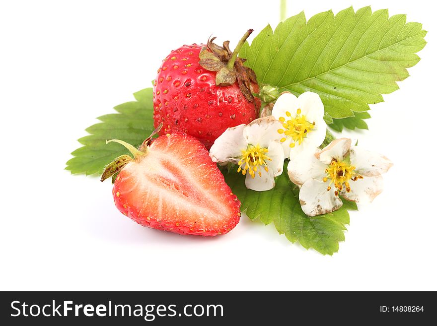 Close-up view of fresh strawberry with leaves and flowers