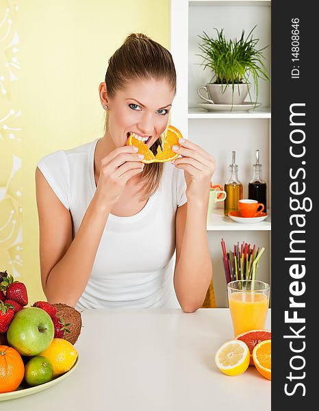 Beauty, young girl eating orange at home