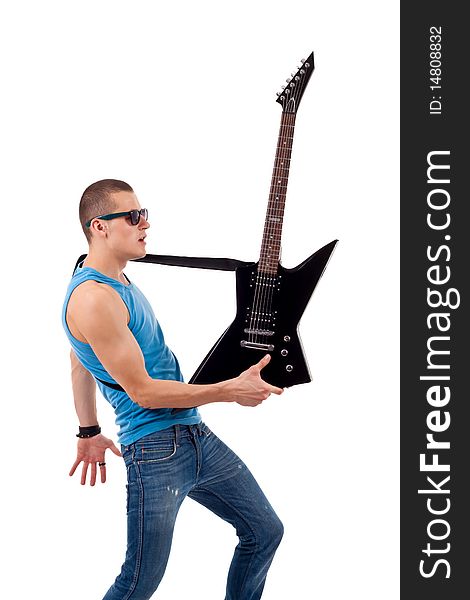 Picture of a guitarist holding his guitar in one hand over white