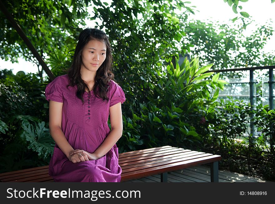 The beautiful woman sat on the bench. The beautiful woman sat on the bench