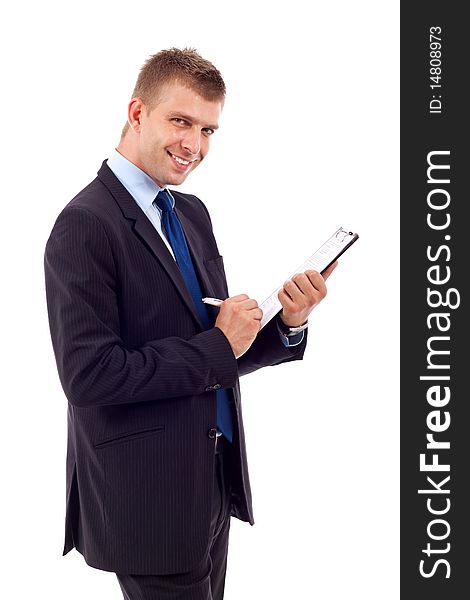 Handsome Businessman in black outfit shot in studio isolated on white - writing on clipboard. Handsome Businessman in black outfit shot in studio isolated on white - writing on clipboard