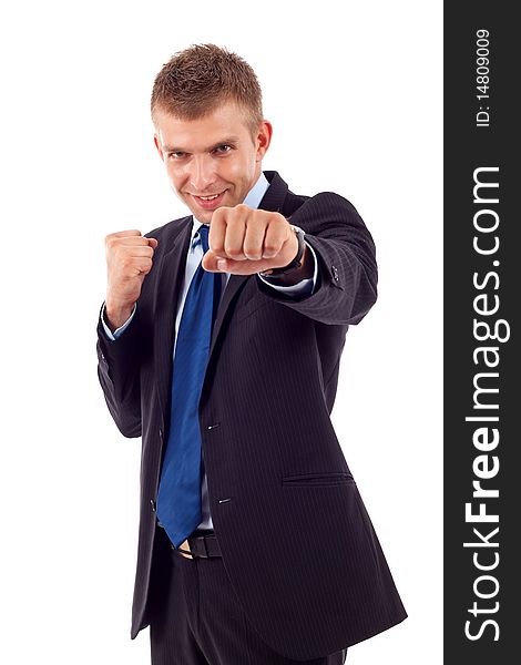 A bisiness man in a combat stance, isolated on a white background