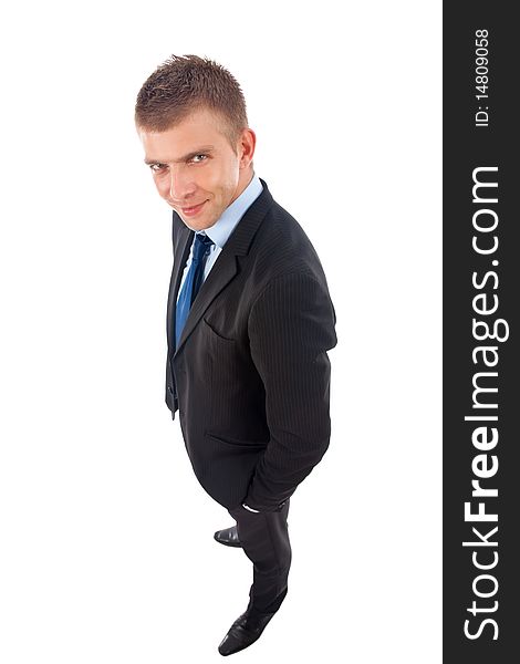 Wide angle picture of a business man standing with hands in pockets over white. Wide angle picture of a business man standing with hands in pockets over white