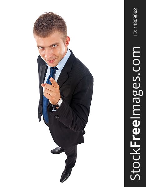 Businessman in suit and tie pointing the finger in front of him - wide angle picture