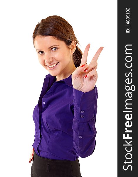 Attractive business woman making victory sign over white