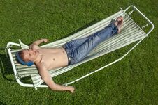 The Guy Is Resting In A Hammock Royalty Free Stock Photo