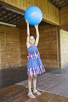 Little Girl Holding Up Ball Royalty Free Stock Images Little Girl Holding Up Ball Royalty Free Stock Images