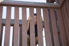 Little Girl Peeking Between Slats Of A Wooden Fenc Stock Photography Little Girl Peeking Between Slats Of A Wooden Fenc Stock Photography