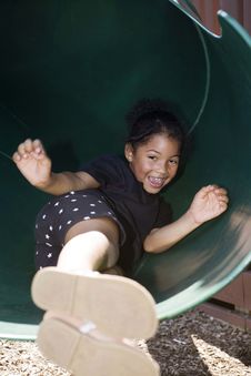 Little Girl Sliding Down The Slide Stock Photo Little Girl Sliding Down The Slide Stock Photo