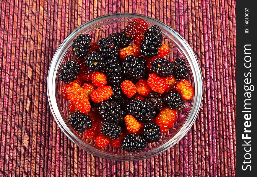 Wild berries in a small clear dish