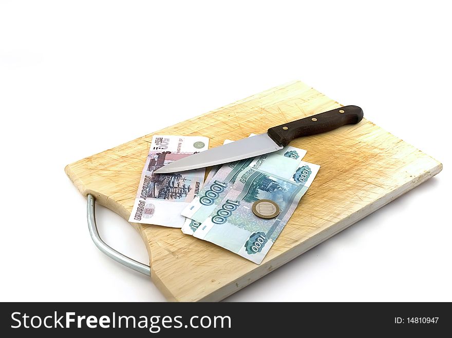 Money, knife for a board for are sharp on a white background.