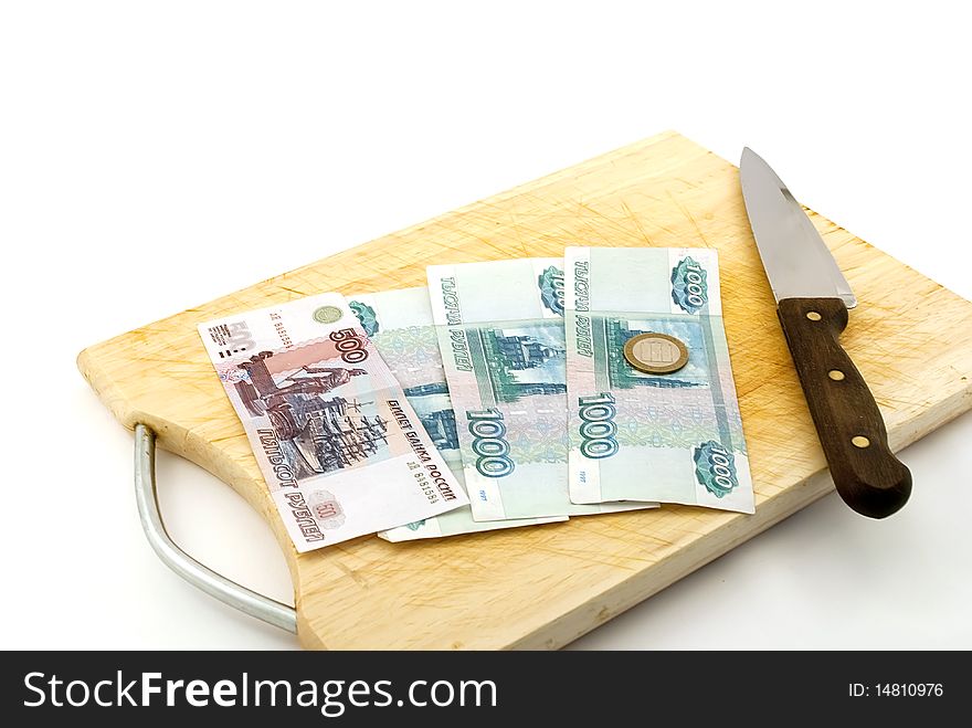 Money, knife for a board for are sharp on a white background.