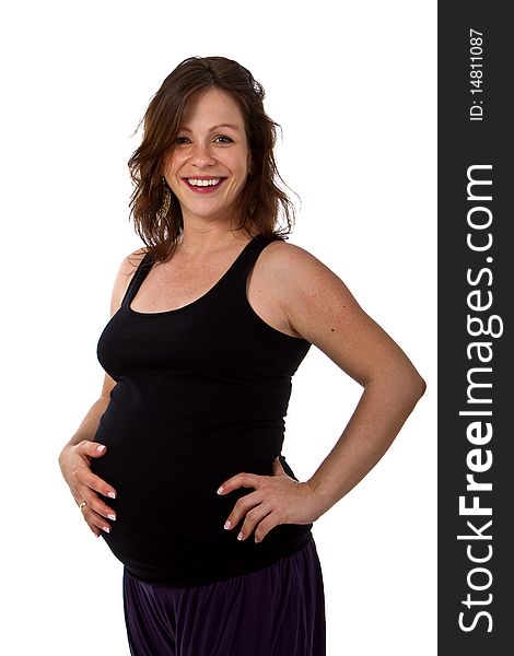 Young pregnant woman in a studio setting isolated over white. Young pregnant woman in a studio setting isolated over white.