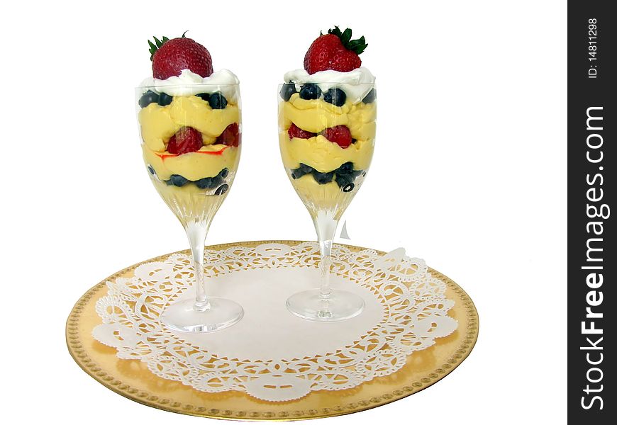 Two parfait in crystal stemware, vanilla with assorted berries. Two parfait in crystal stemware, vanilla with assorted berries.