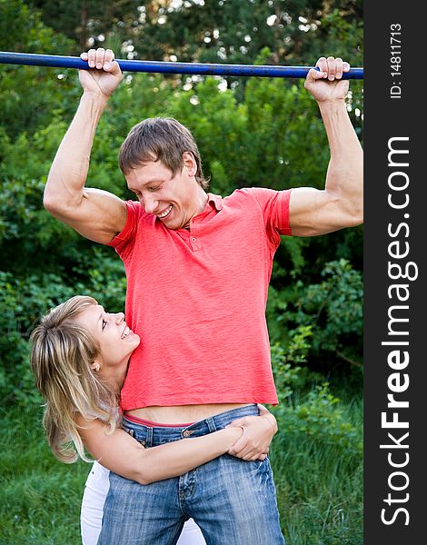 Portrait of a beautiful young couples are happily embracing at walk. Portrait of a beautiful young couples are happily embracing at walk