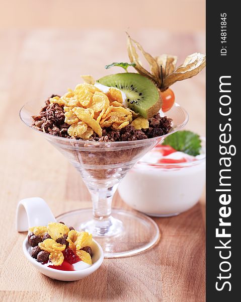 Various types of breakfast cereal and yogurt