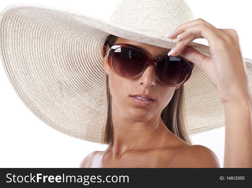 Beautiful blond women wearing a hat and sunglasses in hot summer day. Beautiful blond women wearing a hat and sunglasses in hot summer day