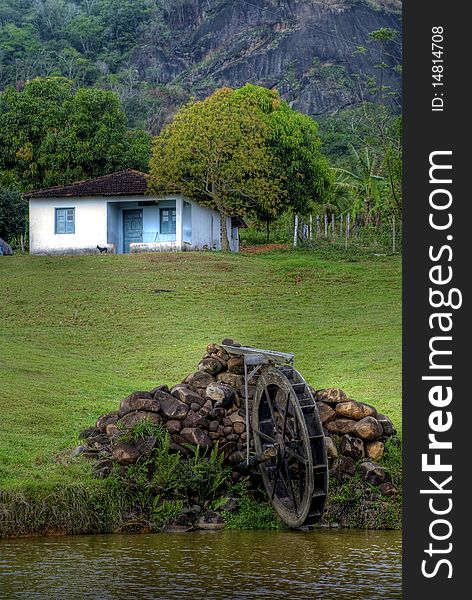 This image is of a house with water mill in rural zone.Was taken in Rio de Janeiro. Photo taken on: September 10th, 2008