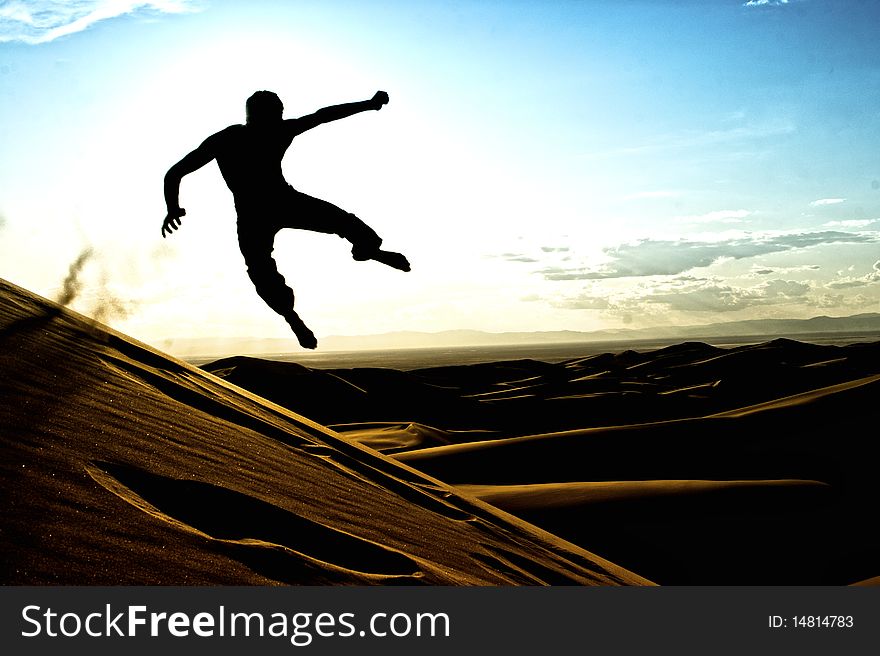 Acrobatic silhouette in the Great Sand Dunes National Park in Colorado. Acrobatic silhouette in the Great Sand Dunes National Park in Colorado