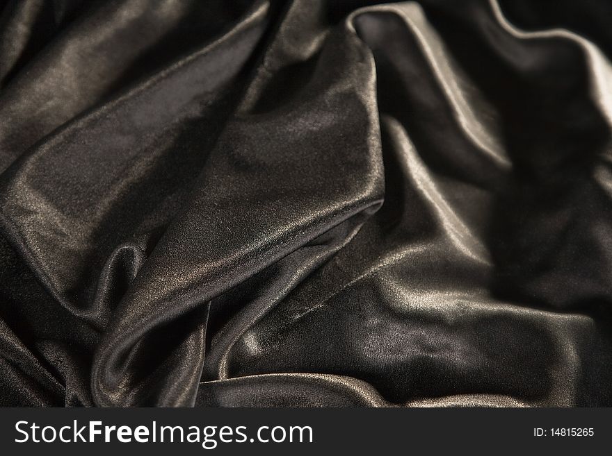 Close-up picture of elegant and soft black fabric fold. Close-up picture of elegant and soft black fabric fold