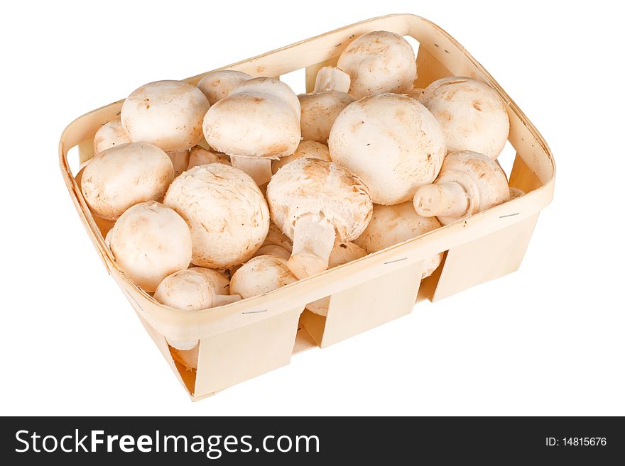 Mushrooms in a basket isolated on white background