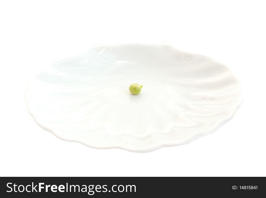 Pea on a white plate on a white background