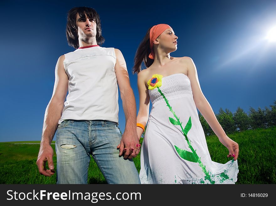 Girl in white dress and boy in jeans. Girl in white dress and boy in jeans