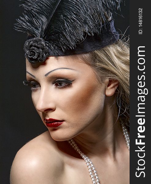 Woman's retro revival portrait. 30's of the XX century. Professional makeup