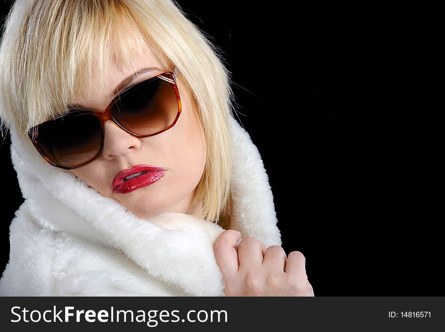 Blond Girl With Fur Coat And Sunglasses