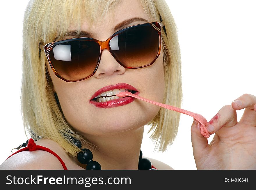 Blond girl enjoys her chewing gum, isolated on white. Blond girl enjoys her chewing gum, isolated on white