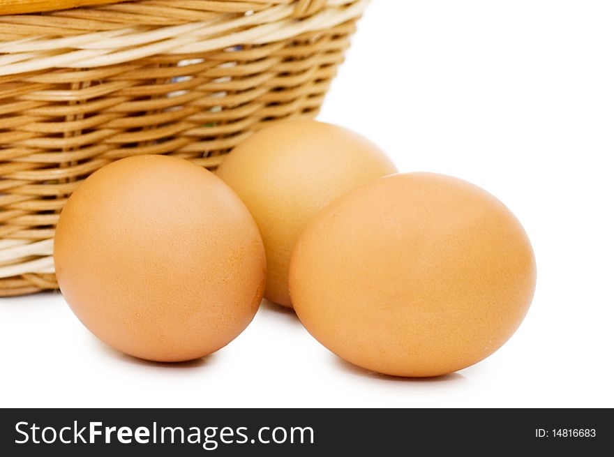 Eggs in a basket on a white background