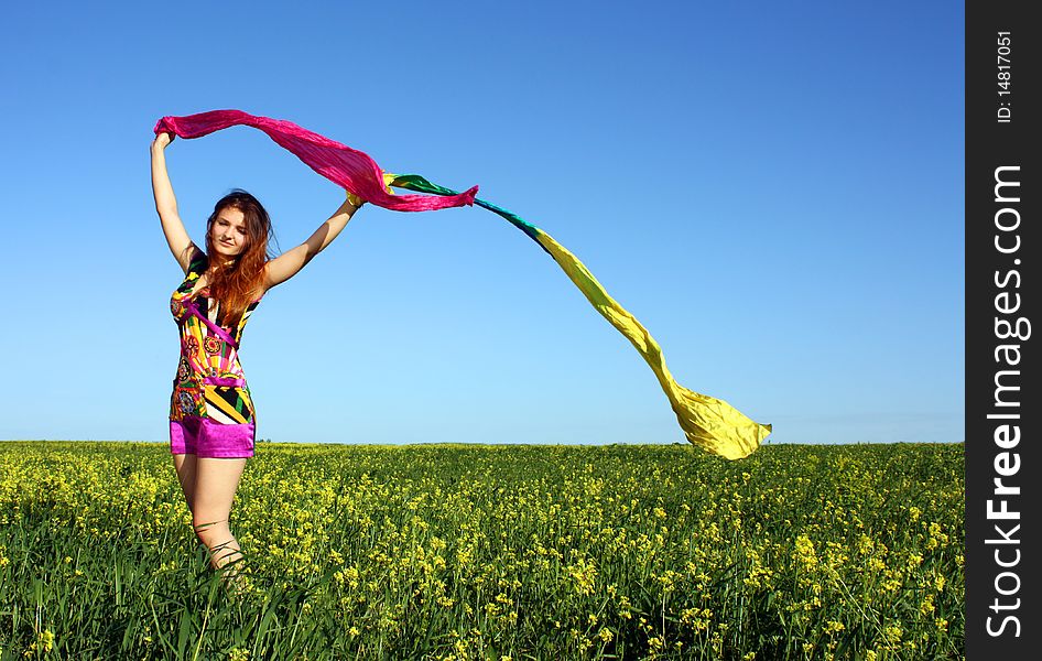 Young Beautiful Woman On Field In Summer