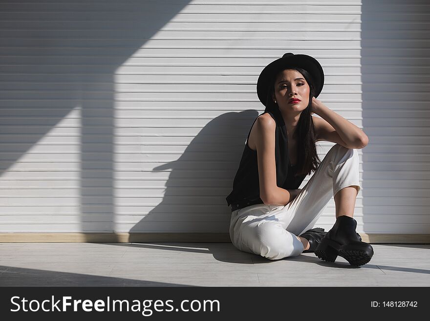 Asian Woman Sitting Near Window